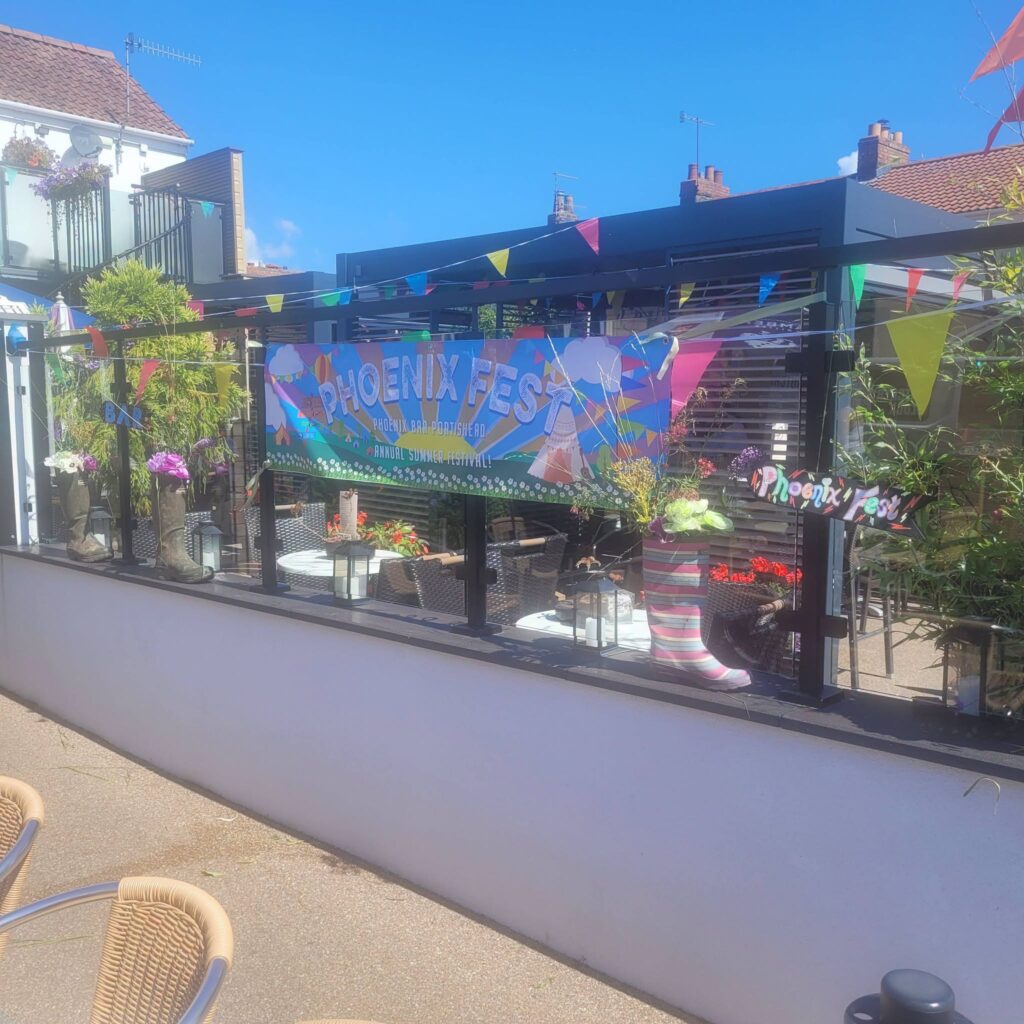 Phoenix Fest banner on the terrace, our annual summer festival