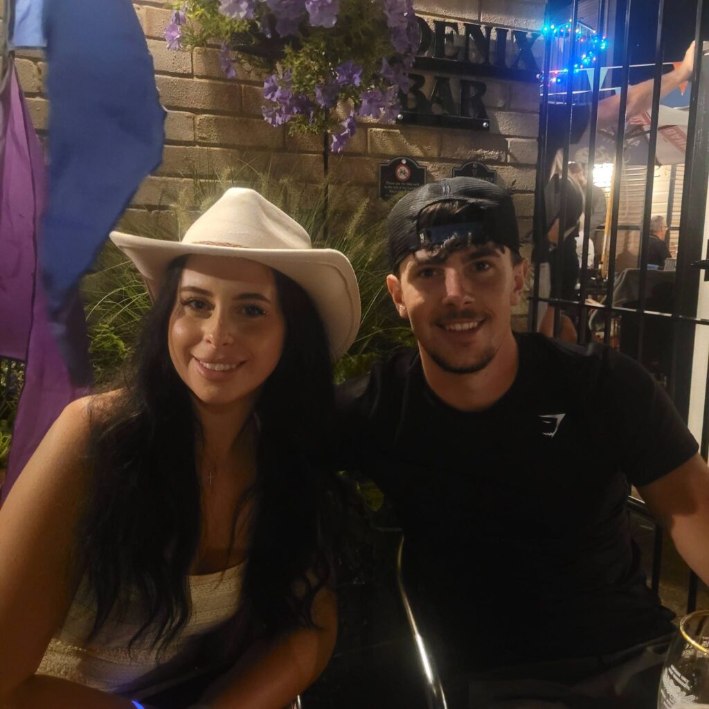 Two guests enjoying an evening outside the Phoenix Bar