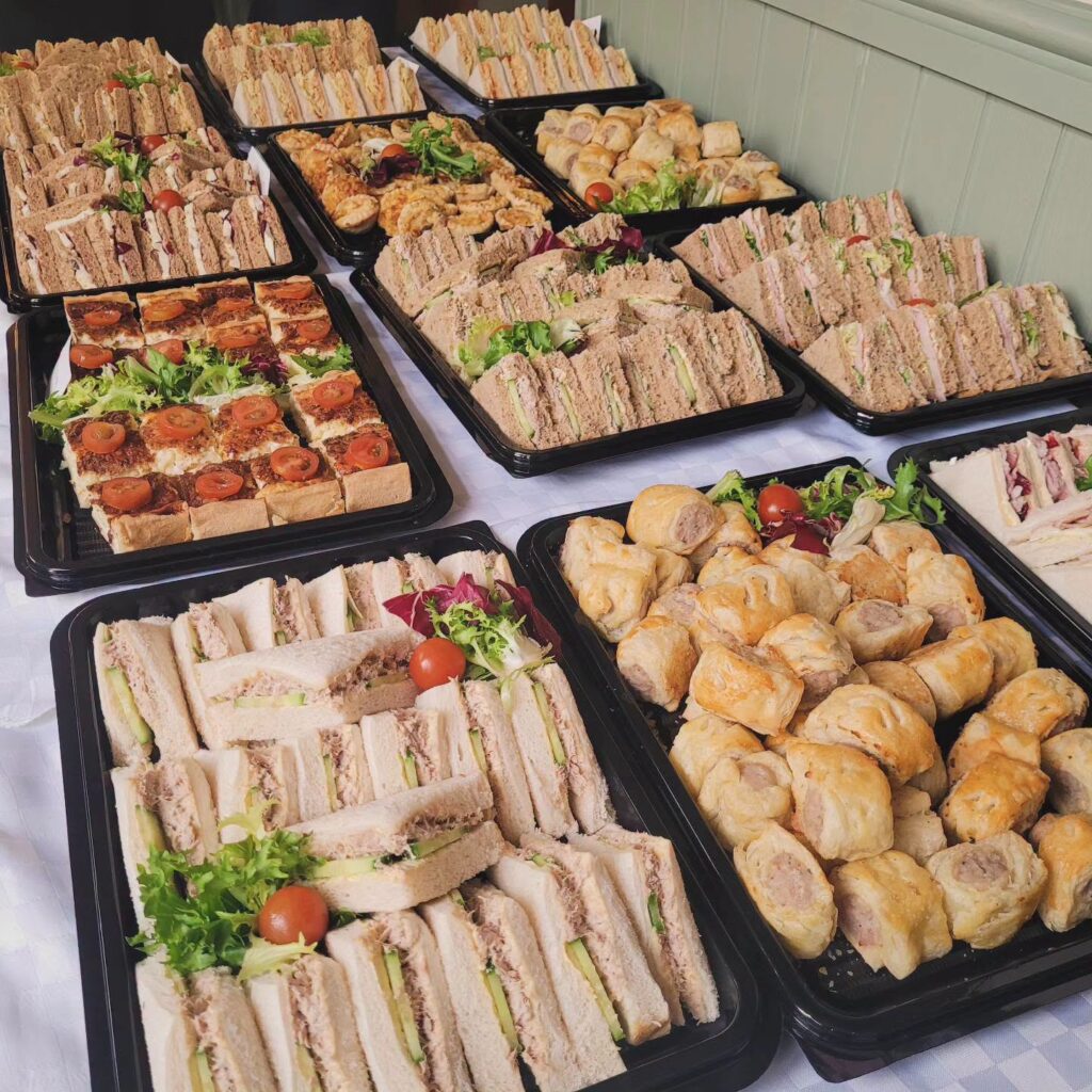 Sandwich and sausage roll platters ready for a party