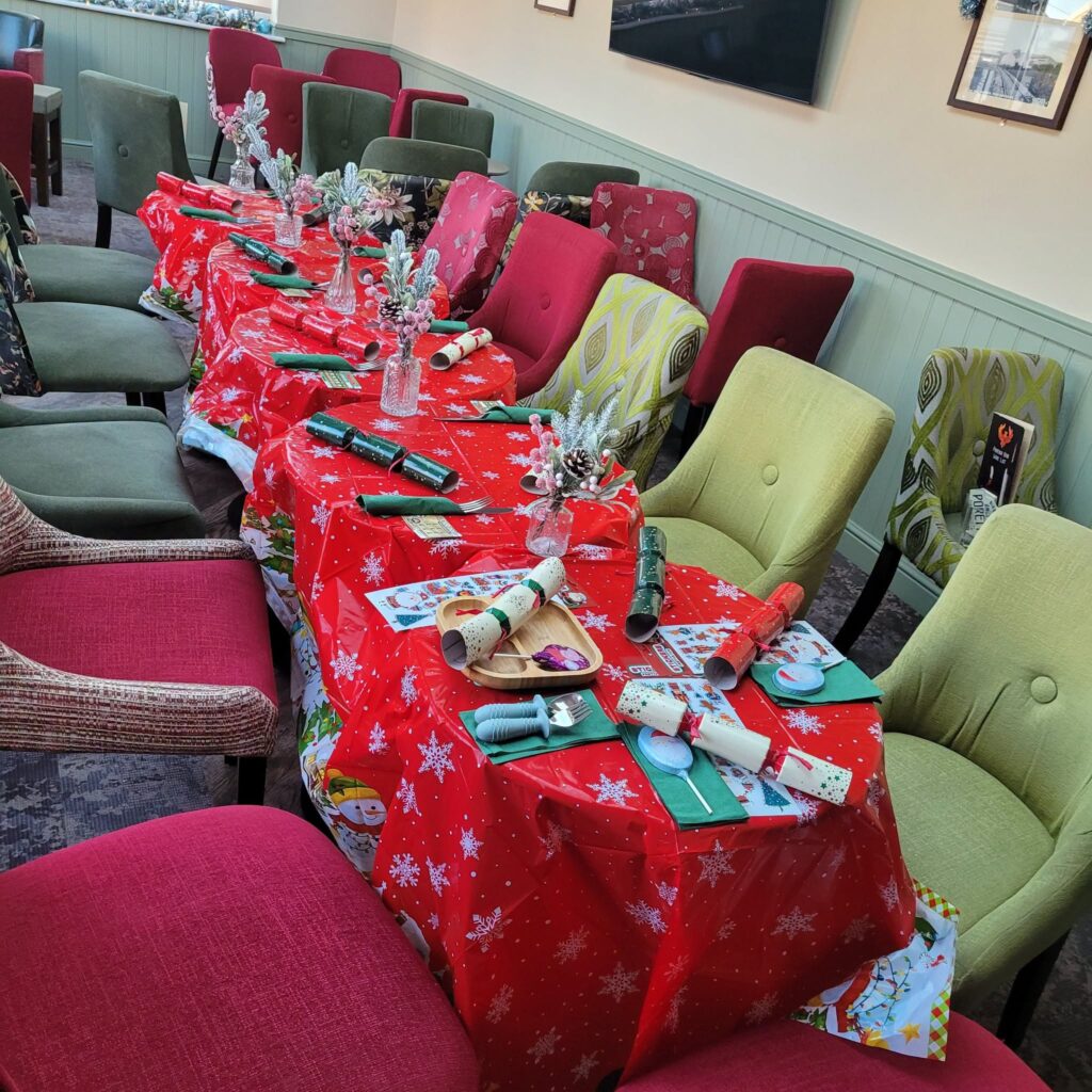 Tables set with crackers for a Christmas party
