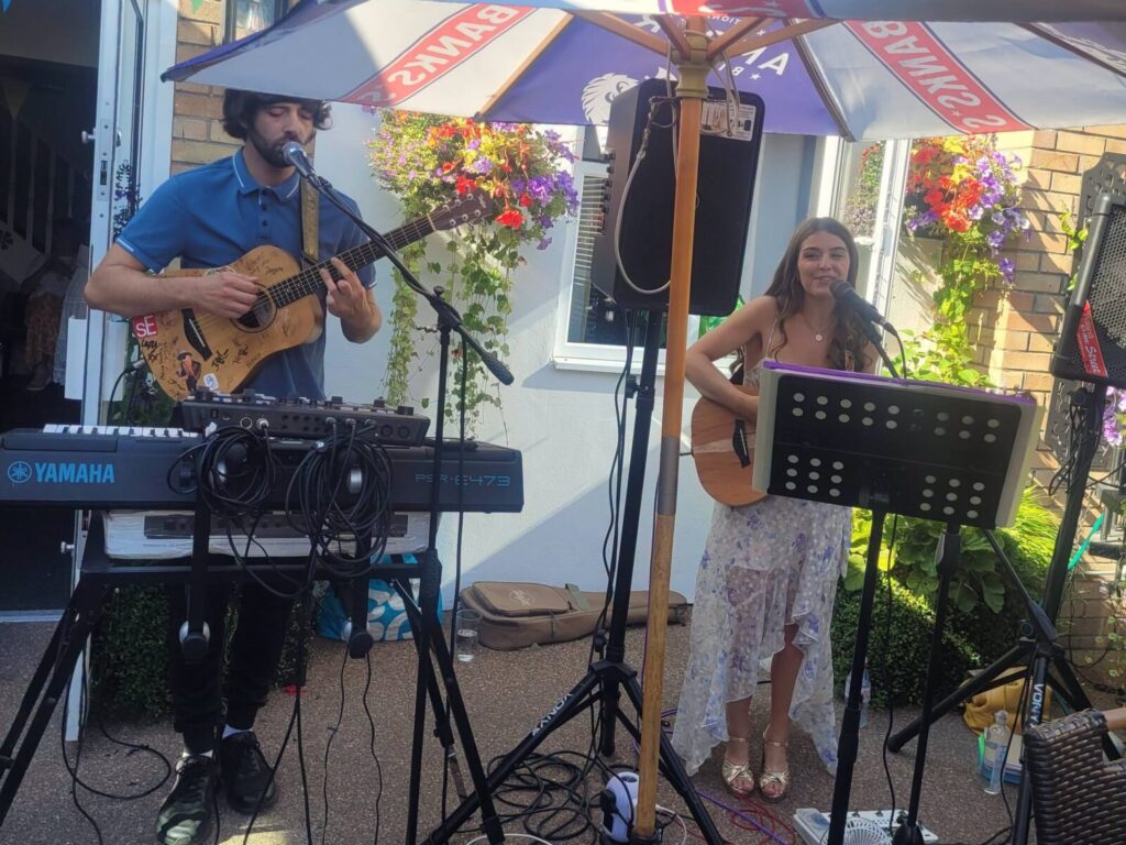 Live acoustic duo playing on the terrace